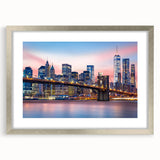 Textured art print of Manhattan skyline in muted gray and blue tones, presented in a silver frame with mat.