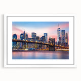 Abstract art print of Manhattan skyline in muted gray and blue tones on a framed white mat, suitable for dining room decor.