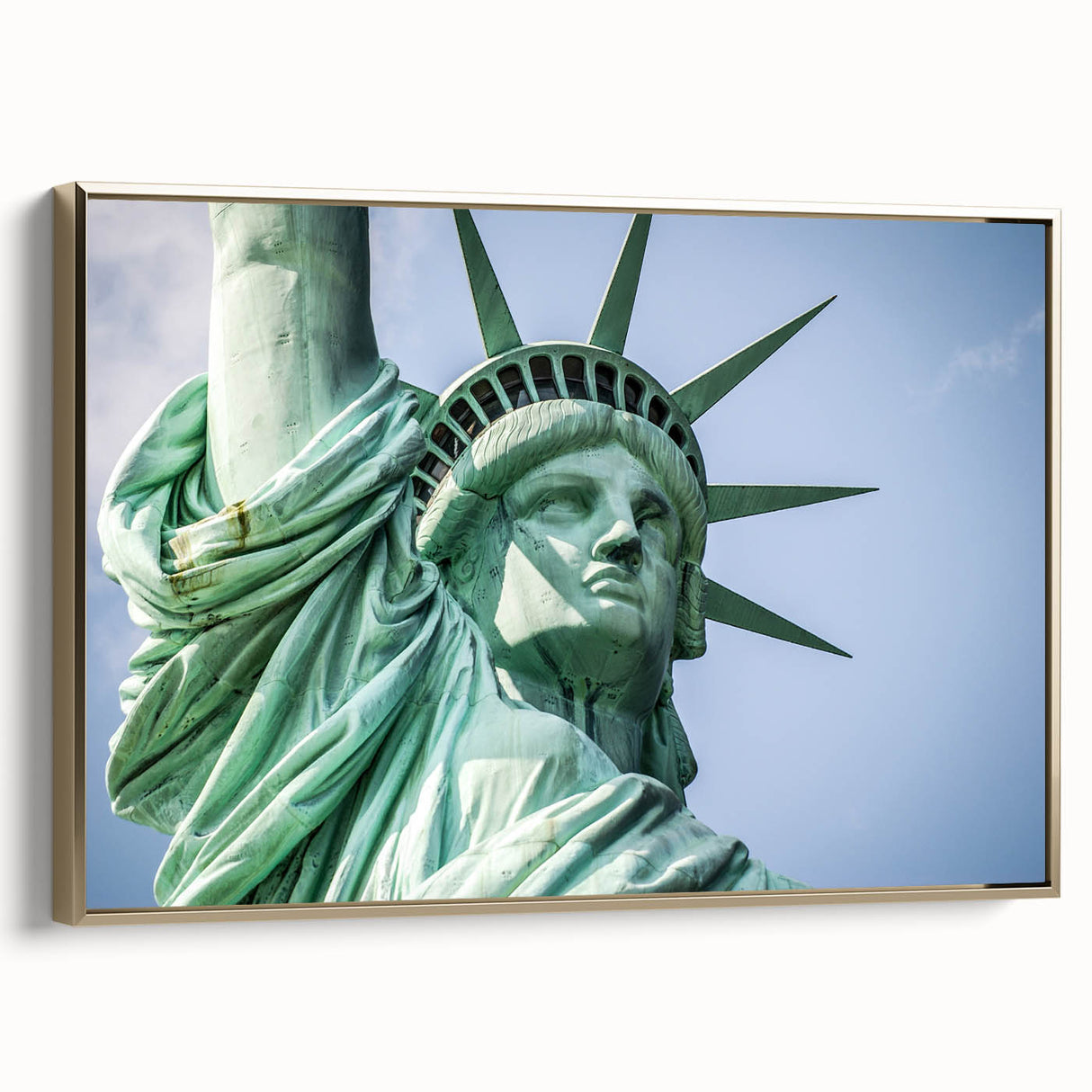 Framed canvas wall art depicting the Statue of Liberty in black and gold tones, suitable for bedroom decor.