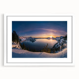 Abstract art print of Crater Lake in muted blue and green tones on a framed white mat, suitable for dining room decor.