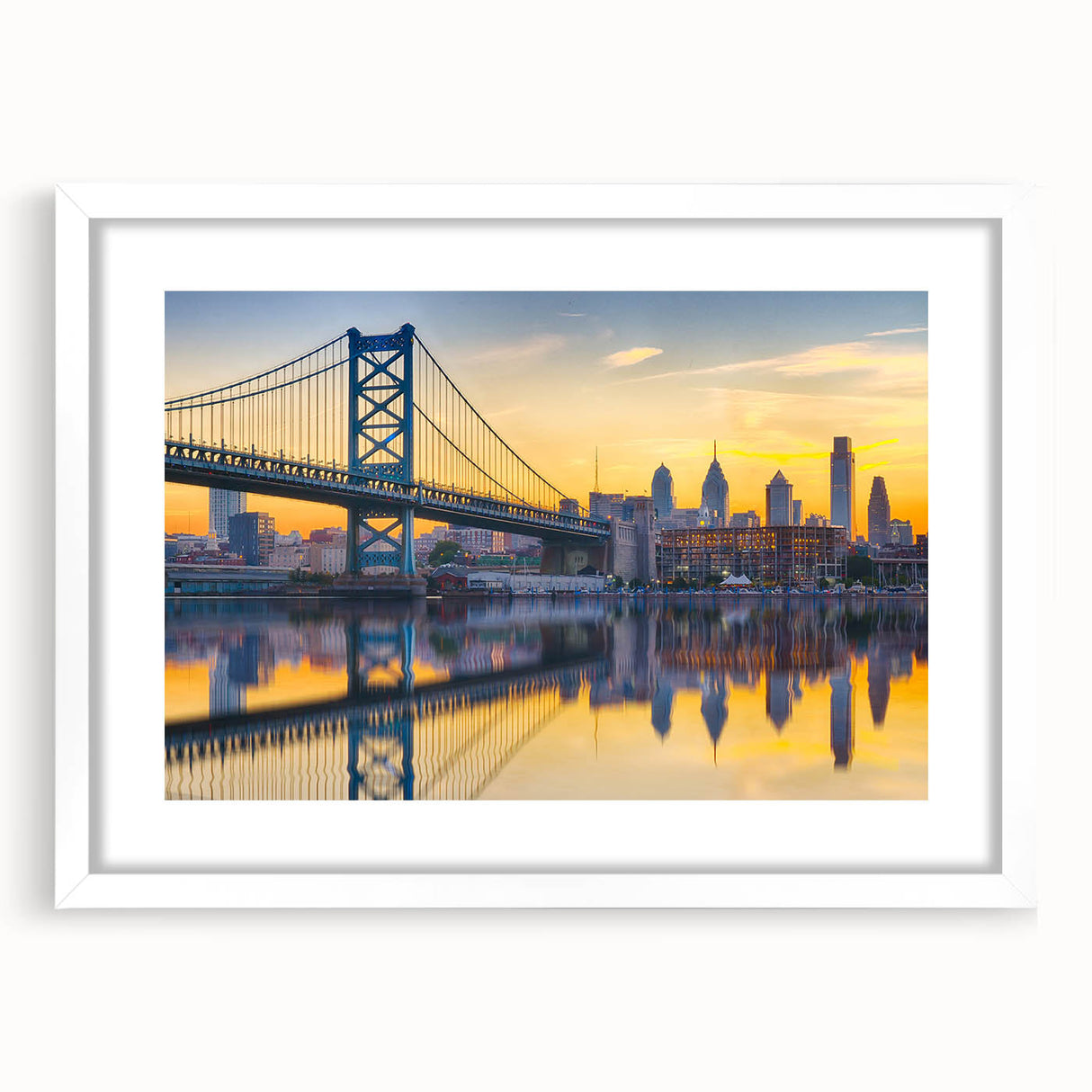 Abstract art print of Philadelphia skyline in muted blue and gray, framed in white, suitable for dining room decor.