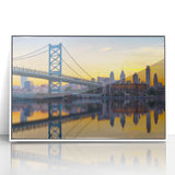 Art deco poster of Philadelphia skyline in muted gray and blue tones, acrylic print framed in white.