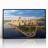 Large abstract wall art depicting Pittsburgh skyline in muted gray and blue tones on framed acrylic.