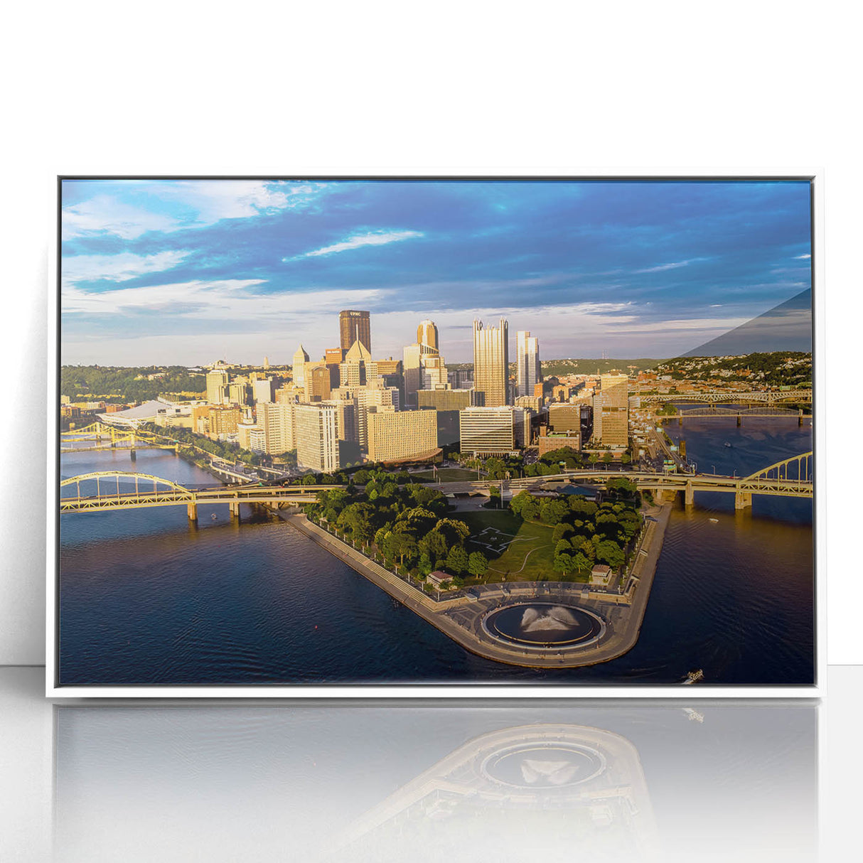 Art deco style poster of Pittsburgh skyline in muted gray and blue tones on a white framed acrylic.