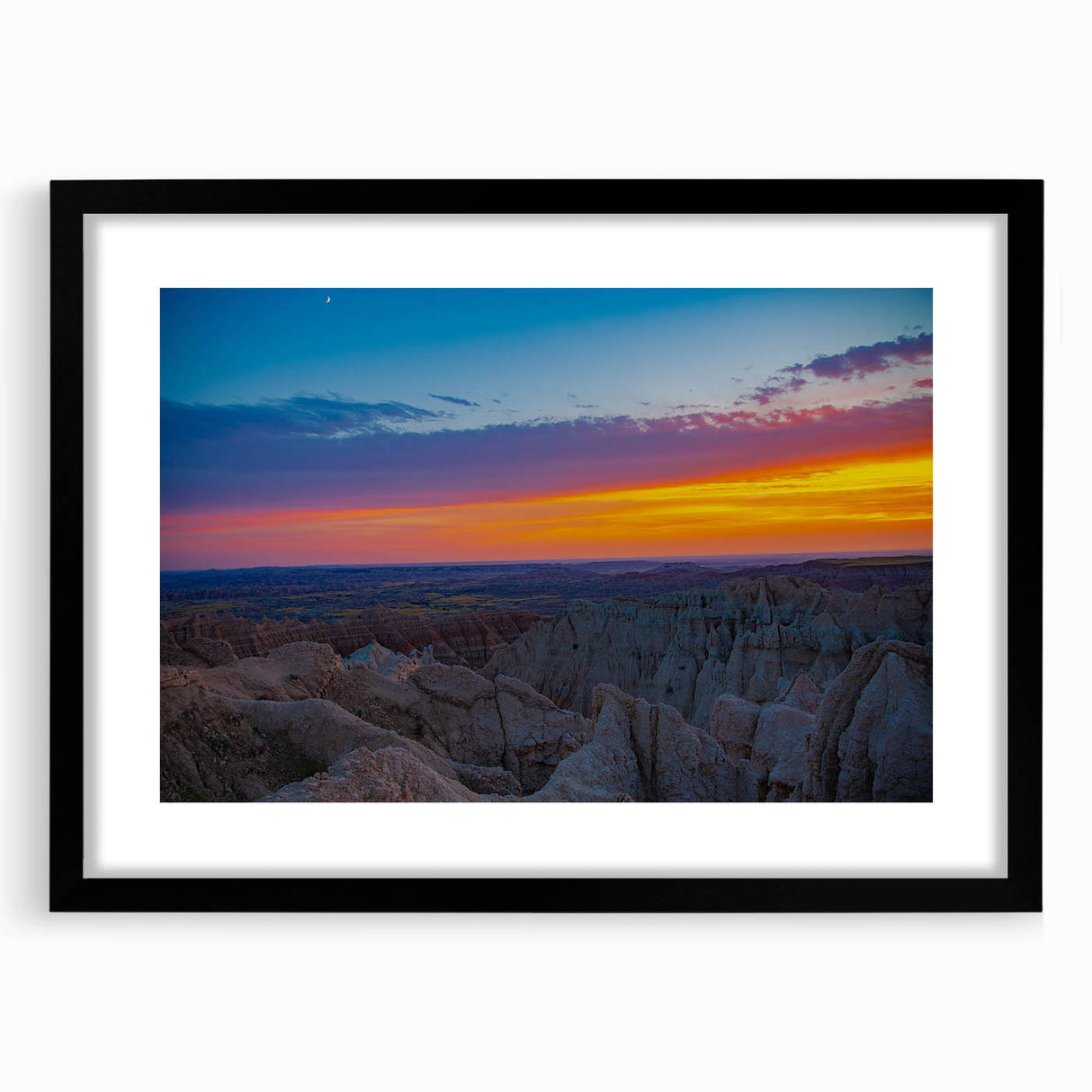 Abstract art print of South Dakota Badlands in black frame with mat, featuring earthy tones, ideal for dining room decor.