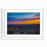 Textured art depicting abstract Badlands scene in earth tones on a white framed mat, suitable for bedroom decor.