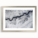 Textured abstract art print depicting South Dakota scenery in muted earth tones on a silver-framed mat.