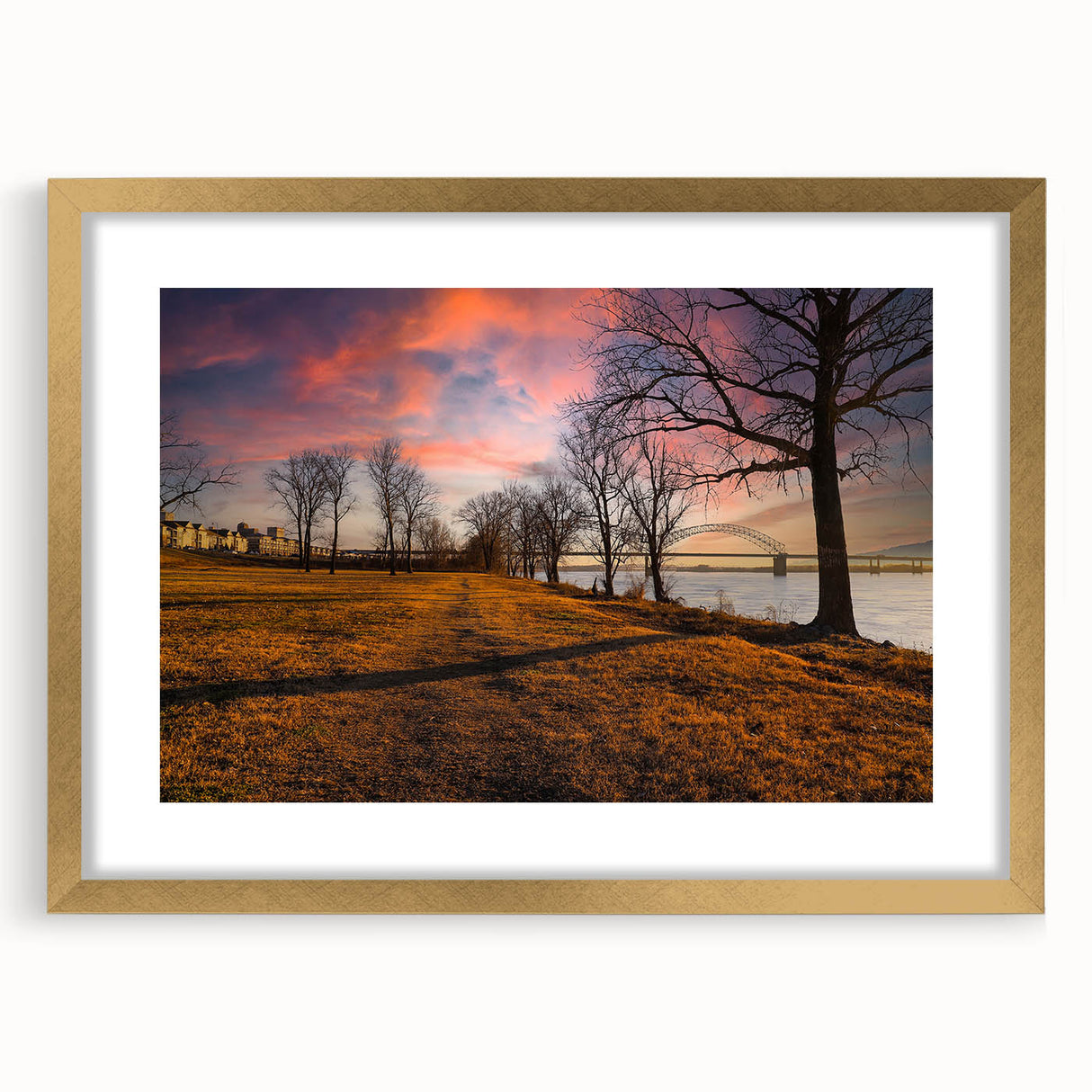 Abstract art print of Memphis scenery in gold frame, featuring textured brush strokes in earth tones.