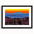 Colorful abstract art print of Bryce Canyon in vibrant orange and red hues on a large textured canvas.