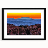Colorful abstract art print of Bryce Canyon in vibrant orange and red hues on a large textured canvas.