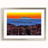 Textured art print of Bryce Canyon in muted orange and red tones on a framed silver mat, ideal for bedroom art.