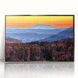 Mid-century modernist art depicting Bryce Canyon in muted earth tones on a silver-framed acrylic print.