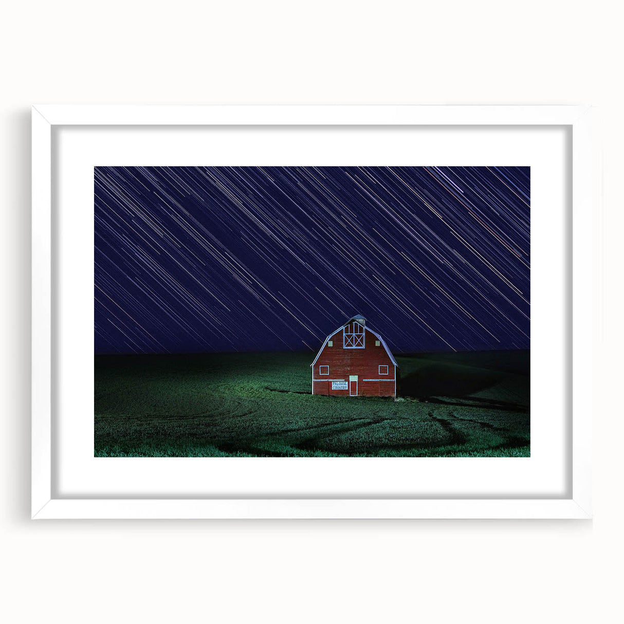 Abstract art print of Palouse, Washington in muted green and brown tones on a framed white mat.