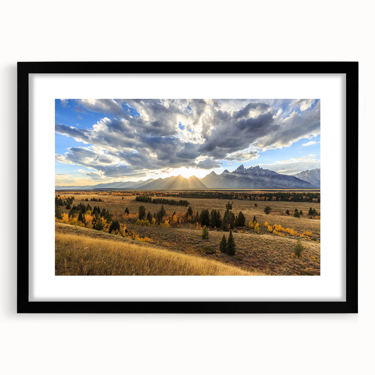 Colorful abstract art print of Wyoming's Grand Tetons in a black frame, ideal for living room decor.