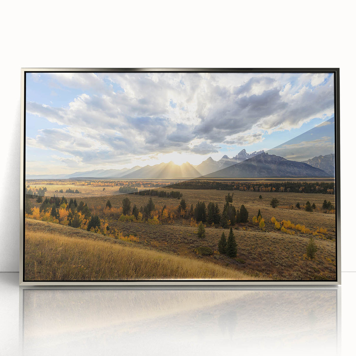 Mid-century modernist art depicting the Grand Tetons in Wyoming, with muted earth tones on a silver-framed acrylic print.