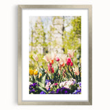 Textured art print of abstract spring-themed design in pastel shades, framed in silver, suitable for bedroom decor.