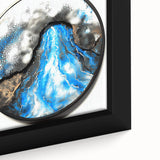 Abstract geometric framed canvas close-up showcasing vibrant blue, orange, and yellow shapes, perfect for modern home decor and art enthusiasts.