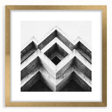 Extra large abstract art print featuring textured swirls in gold and black, framed with a mat, ideal for living room decor.