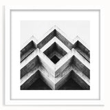 Abstract art print featuring swirling blue and gray patterns on a white framed canvas.