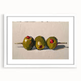 Abstract art print featuring assorted fruits in vibrant colors on a white framed mat, ideal for dining room decor.