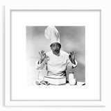 Abstract art print featuring stylized food and people in muted earth tones, framed in white, ideal for dining room decor.