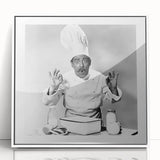 Modern art wall decor featuring an art deco poster of stylized food and people, in pastel shades, framed in white acrylic.