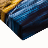 Close-up of a stretched landscape canvas featuring vibrant abstract art with bold colors and intricate textures, ideal for modern home decor and artistic expression.