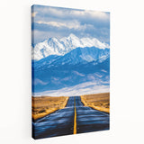 Side view of a stretched canvas showcasing vibrant abstract landscape art with rich colors and textures, ideal for home decor or artistic display.