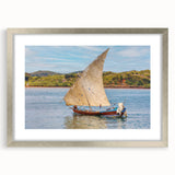 Abstract art print of a Madagascar landscape in muted earth tones on a framed silver canvas, suitable for dining room decor.