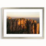 Textured abstract art print depicting a South African landscape in earth tones, framed in silver, ideal for bedroom art.