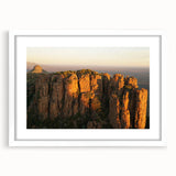 Abstract art print of a South African landscape in muted earth tones, framed with a white mat.