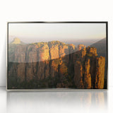 Mid-century modernist art depicting a South African scenery in muted earth tones on a silver-framed acrylic print.