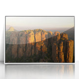 Art deco poster of South African scenery in muted earth tones, acrylic print in white frame.