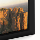 Extra large framed canvas depicting a textured, colorful African landscape in muted earth tones, ideal for living room decor.