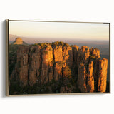Framed canvas wall art featuring a vintage-style African landscape in gold and black tones, ideal for bedroom decor.