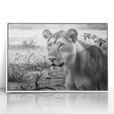 Art deco poster of an African landscape on white framed acrylic, featuring muted earth tones.