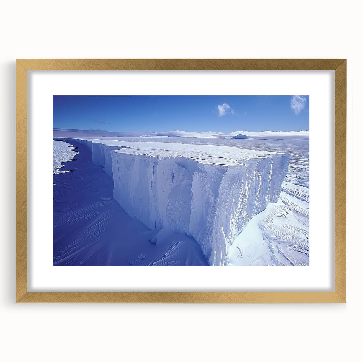 Extra large abstract art print of a textured Antarctic landscape in muted blue and white, framed in gold.