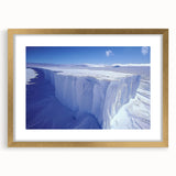 Extra large abstract art print of a textured Antarctic landscape in muted blue and white, framed in gold.