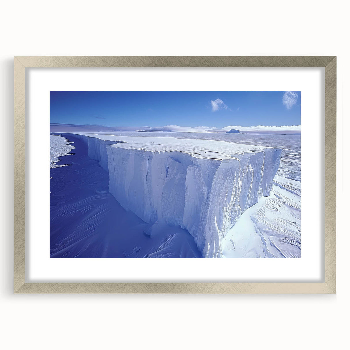 Textured abstract art print depicting an Antarctic landscape in muted blue and white tones, framed in silver.