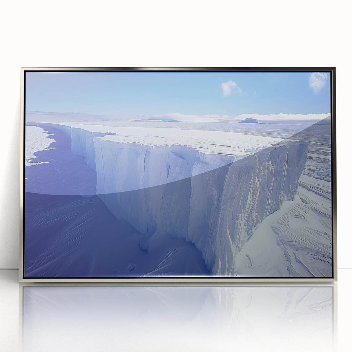 Mid-century modernist art depicting an Antarctic landscape in muted blue and white tones, framed in silver acrylic.