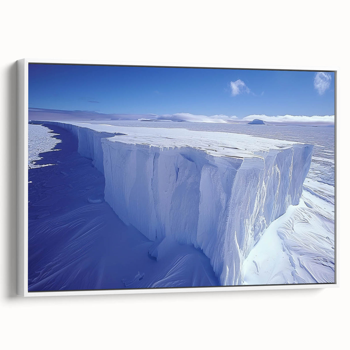 Vintage poster art of an Antarctic scenery on a framed canvas, featuring a palette of white and blue.