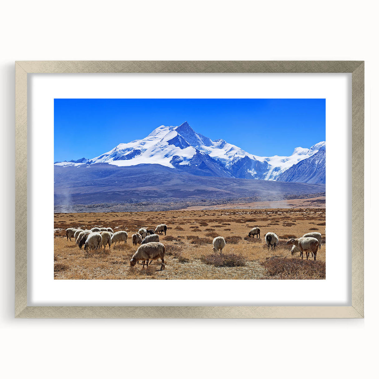 Textured art depicting an abstract Tibetan landscape in muted earth tones, framed in silver, ideal for bedroom art.