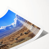 Extra large wall art featuring line art flowers in muted earth tones on a rolled canvas.