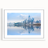 Abstract art print of Hong Kong skyline in muted gray and blue tones on a framed white canvas.
