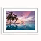 Abstract art print of a serene Maldivian landscape in soft blue and white tones, framed with a white mat.