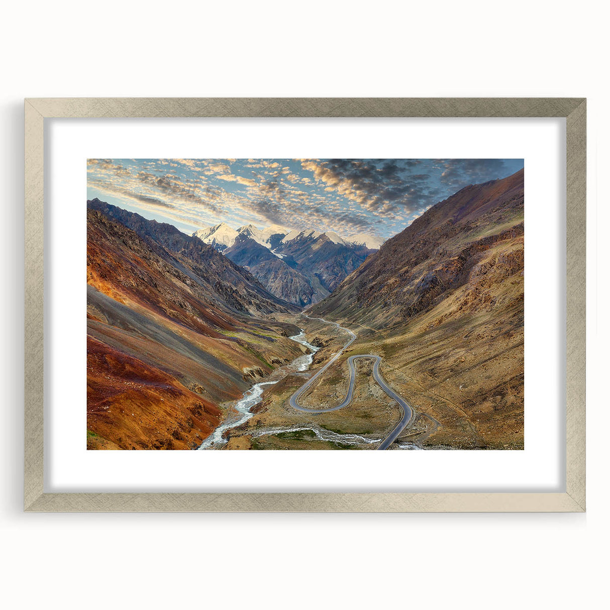 Textured art print of abstract scenery in muted earth tones on a silver-framed canvas, ideal for bedroom decor.
