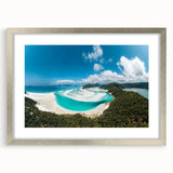 Abstract art print of the Great Barrier Reef in blue and green tones, framed in silver, suitable for dining room decor.