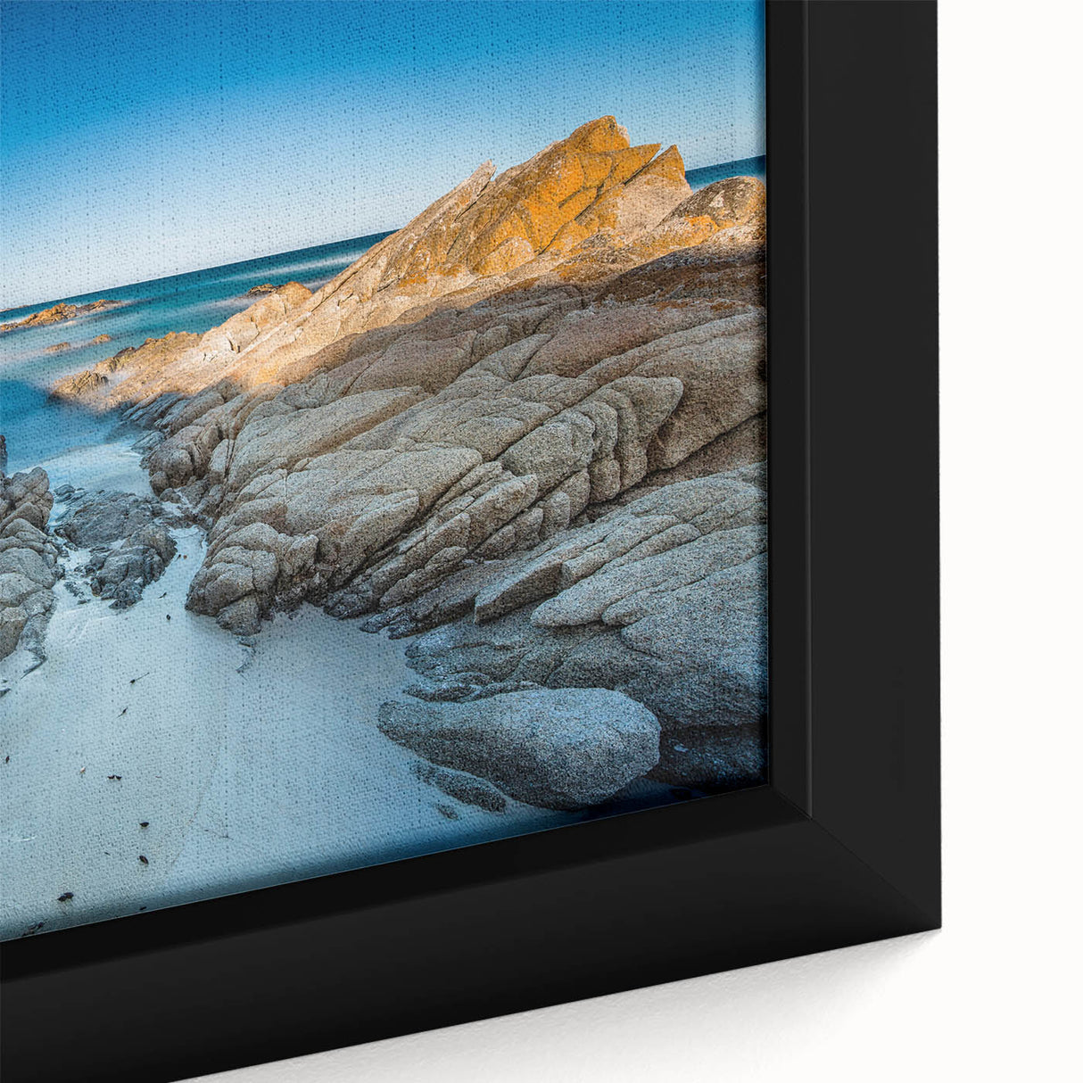 Black wall art depicting a textured Tasmanian landscape on extra large framed canvas, in vibrant colors.