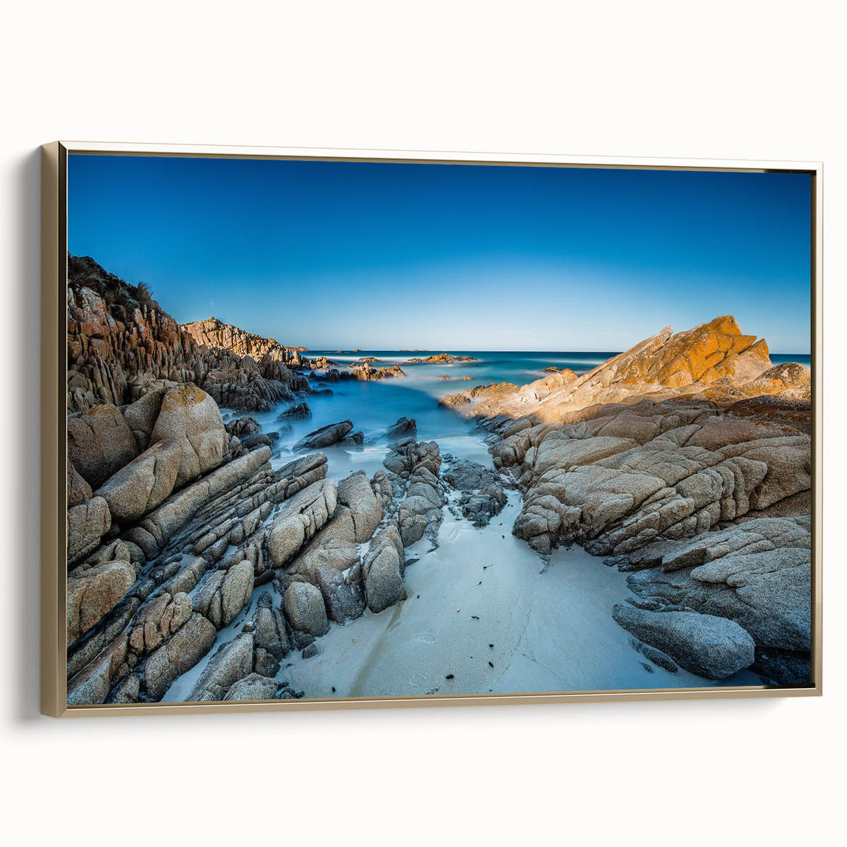 Framed canvas depicting a serene Tasmanian landscape in muted green and blue tones, ideal for bedroom wall art.