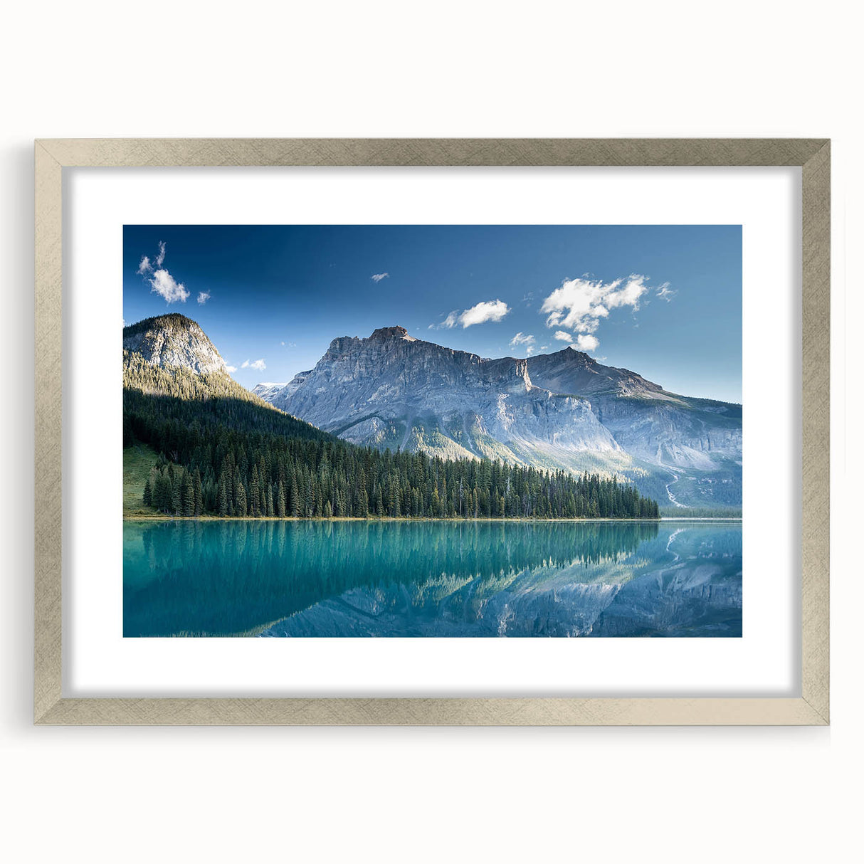 Textured art print of British Columbia scenery in muted green and blue, framed in silver, suitable for bedroom decor.